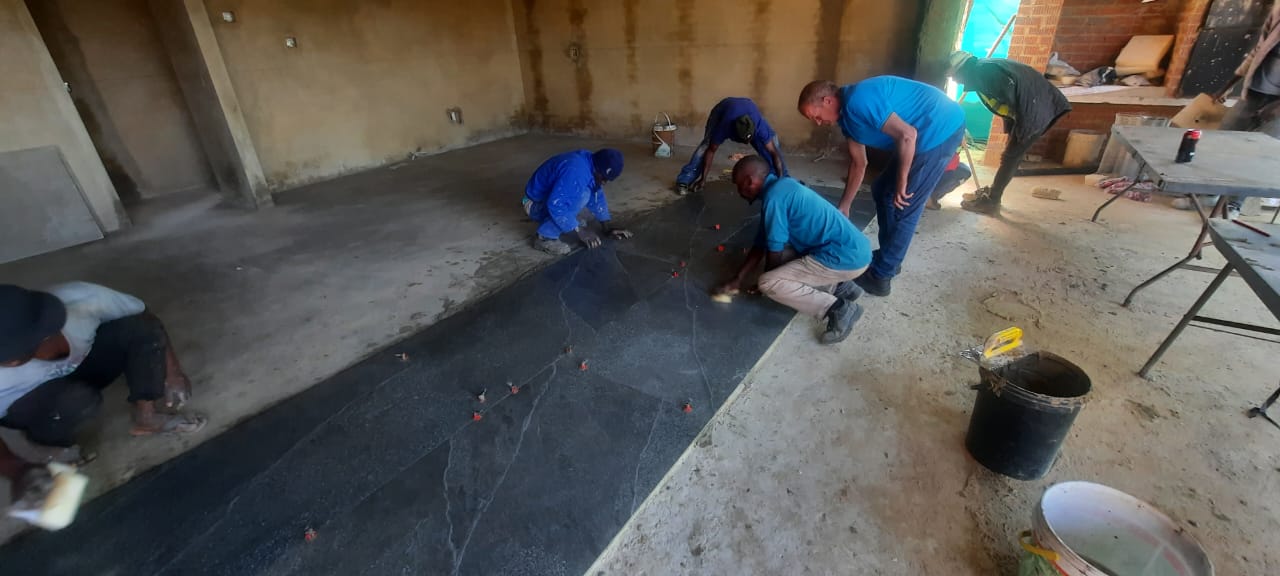 Team working on flooring
