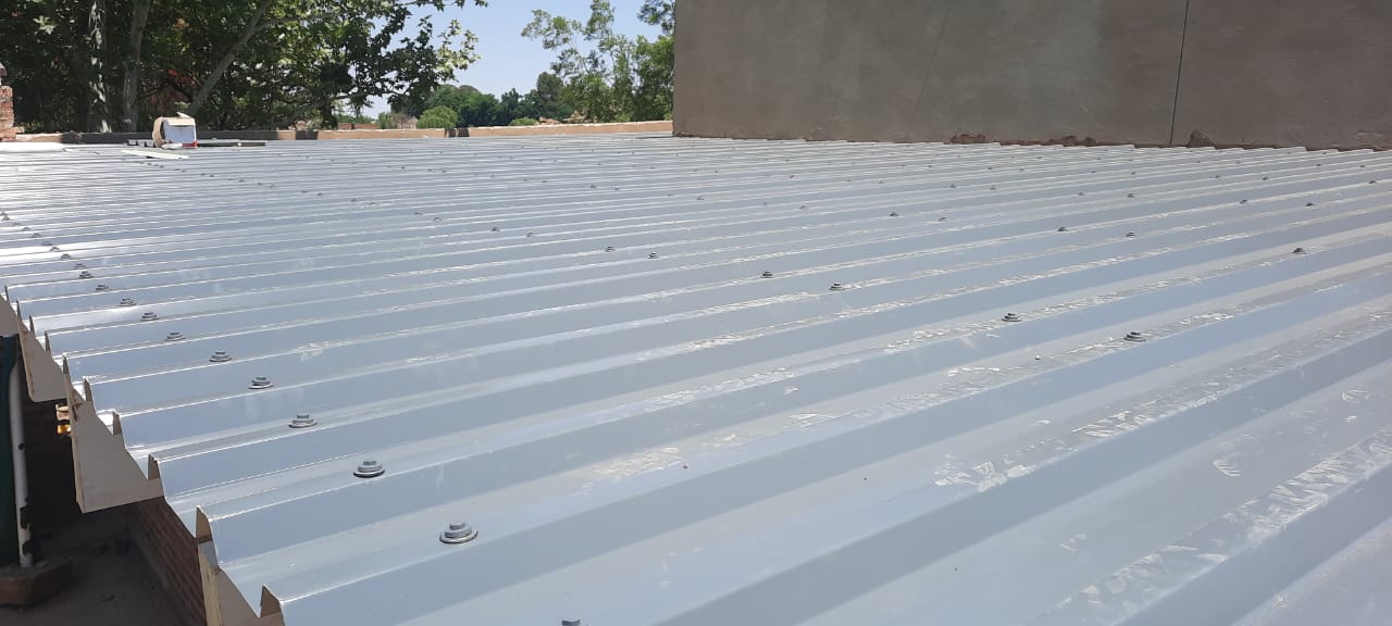 Galvanized roof sheets fixed in place